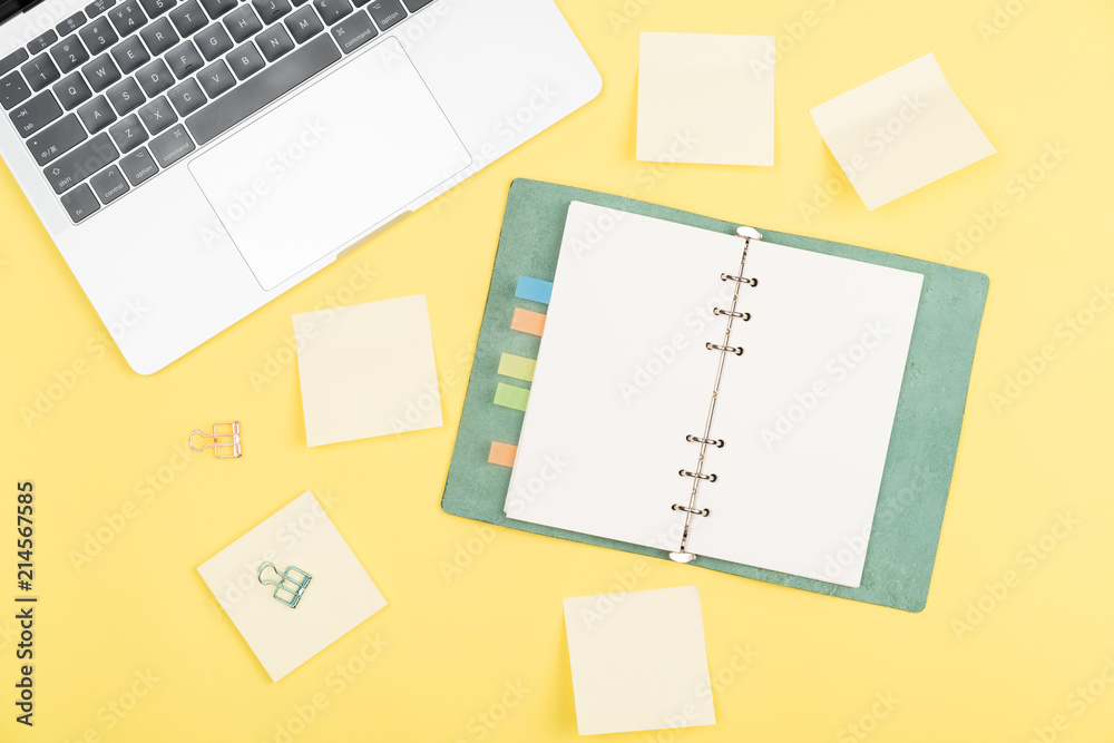 notebook on yellow background notebook on yellow background