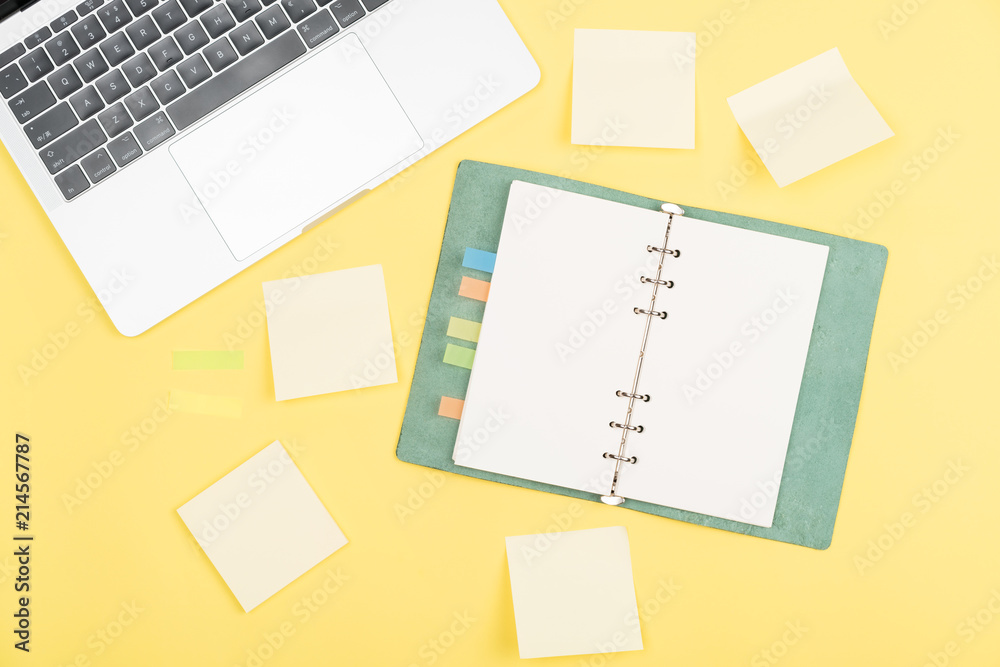 notebook on yellow background notebook on yellow background