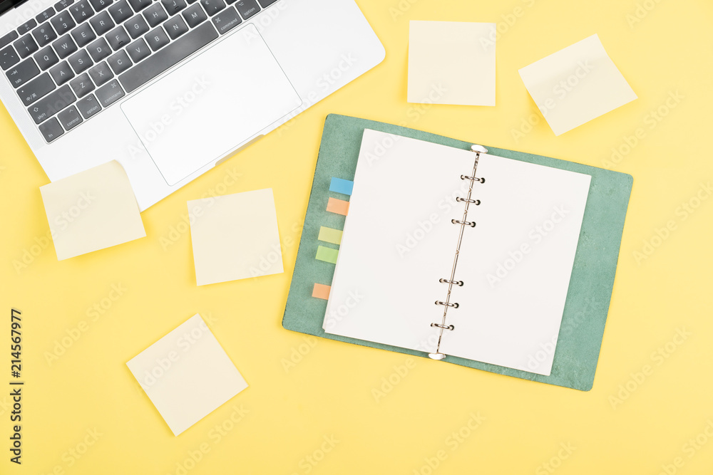 notebook on yellow background notebook on yellow background