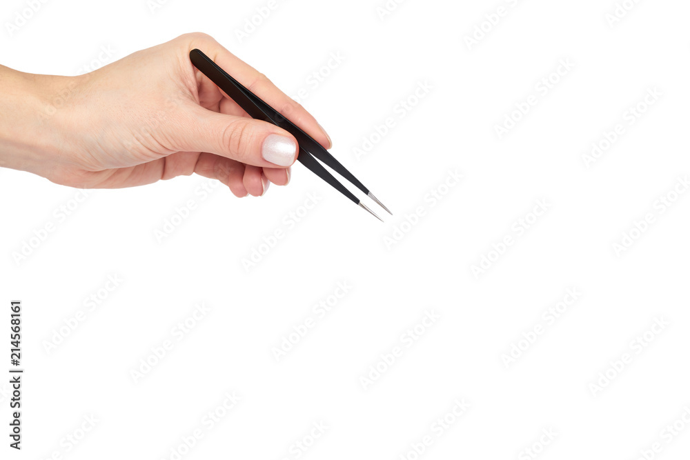 Black makeup tweezer with hand, isolated on white background, copy space template Black makeup tweezer with hand, isolated on white background, copy space template