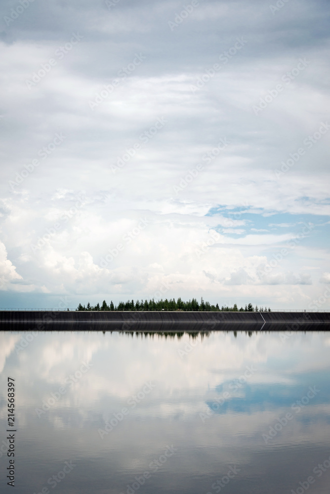 Water reservoir Cierny Vah with sky reflection in the water, Liptov, Slovakia Water reservoir Cierny Vah with sky reflection in the water, Liptov, Slovakia