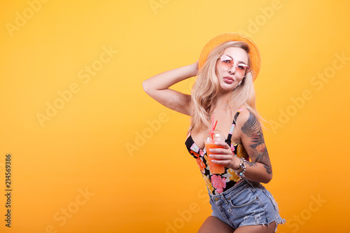 attractive young woman feeling good drinking orange juice