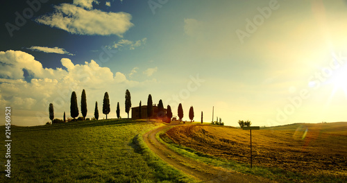 typical Tuscany countryside landscape  sunset over rolling hills and Tuscany village