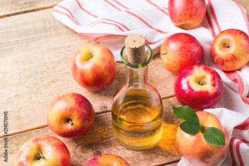 Apple cider vinegar in bottle with apple