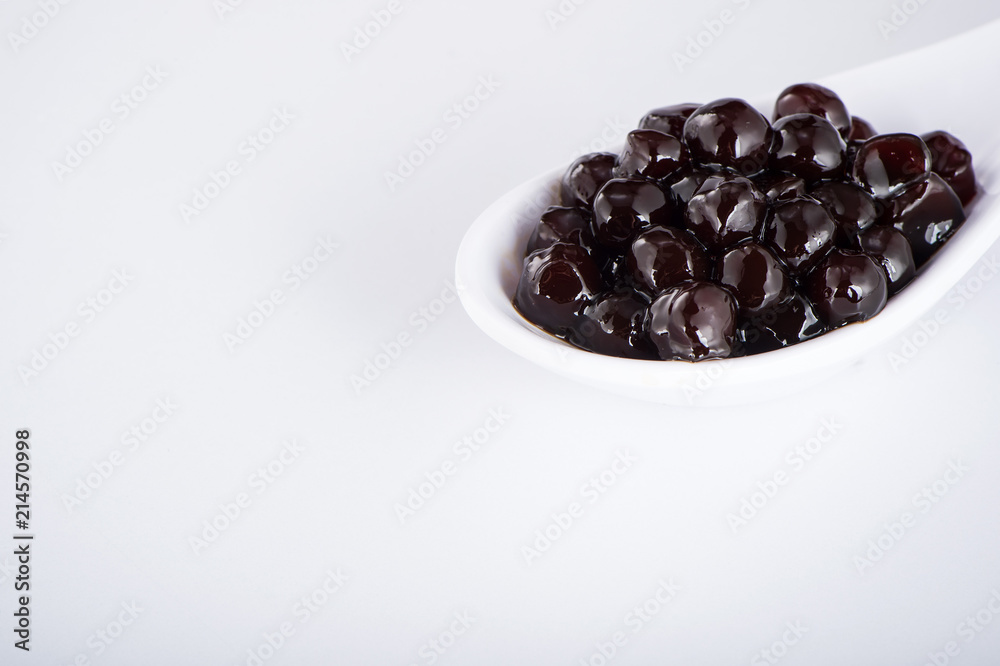 black pearls. Boiled tapioca pearls for bubble tea on white background. Copy space black pearls. Boiled tapioca pearls for bubble tea on white background. Copy space