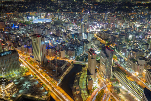 aerial view of buildings and traffic trails at night in Yokohama, Japan