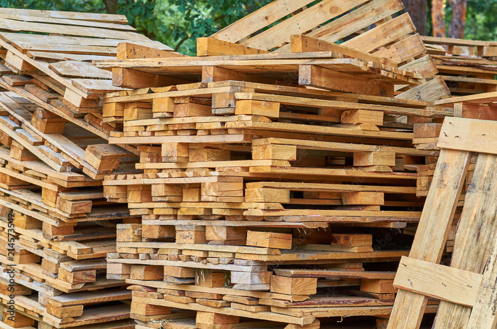 Wooden pallets stacked on top of each other. Wooden pallets stacked on top of each other.
