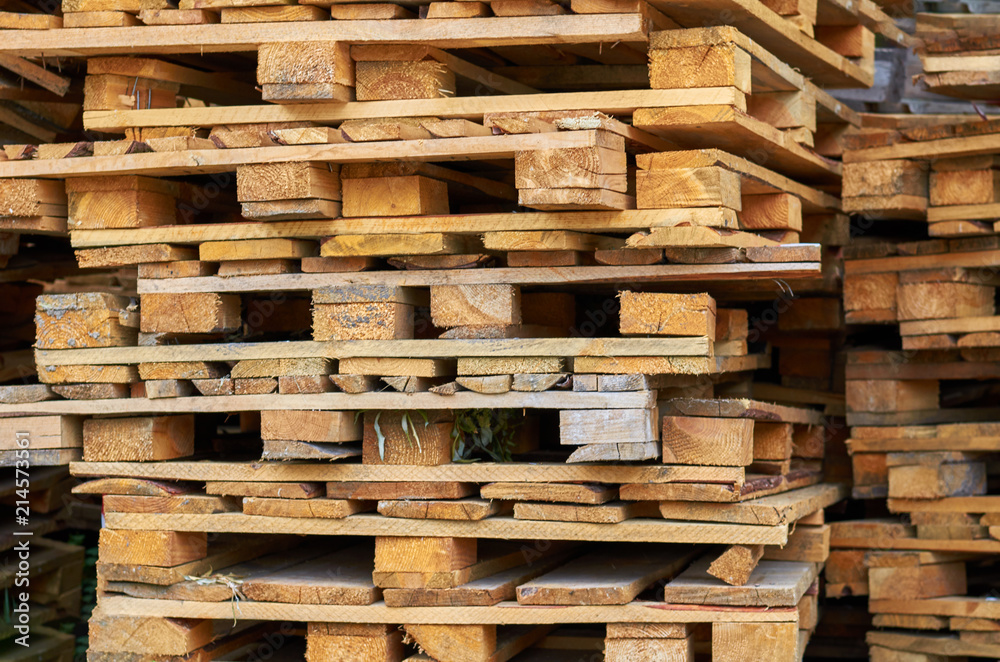 Wooden pallets stacked on top of each other. Wooden pallets stacked on top of each other.