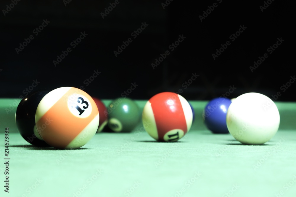 Billiards balls on a green board Billiards balls on a green board