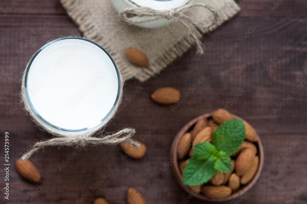 Top view almond milk with almond on the table. Top view almond milk with almond on the table.