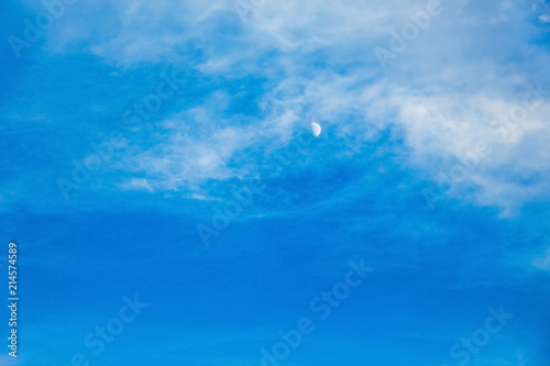Blue sky with moon and white clouds in the evening_ © Volodymyr