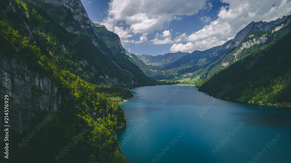 aerial view of deep blue mountain lake in swiss alps, klontalersee switzerland aerial view of deep blue mountain lake in swiss alps, klontalersee switzerland