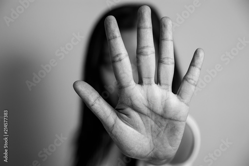 woman raised her hand for dissuade, campaign stop violence against women. Asian woman raised her hand for dissuade with copy space, black and white color photo