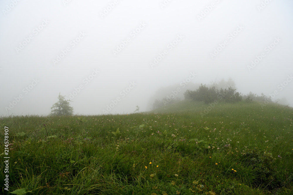Mountain landscape in the Alps in the fog Mountain landscape in the Alps in the fog