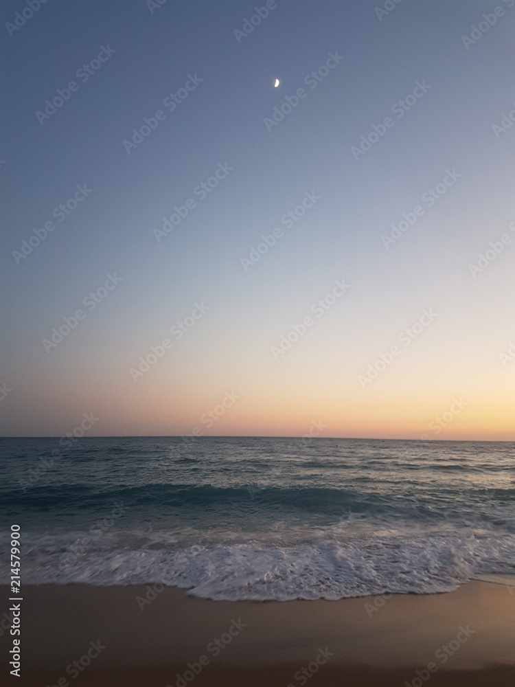 Fototapeta premium sunset sea waves foam splash in summer Preveza Vrahos Greece