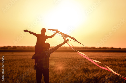 Happy father and son flying...