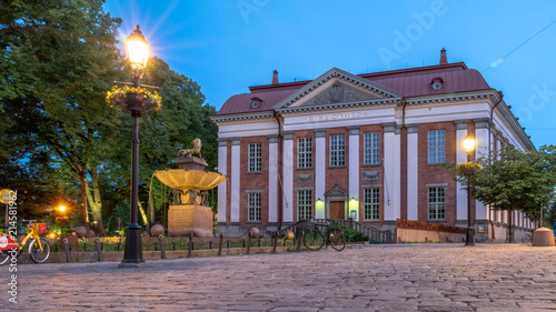 Turku City library at night. At the wall of the building reads in latin biblioteca that meas a library in english.