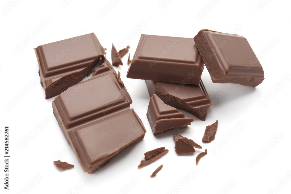 Fototapeta premium Delicious milk chocolate pieces on white background