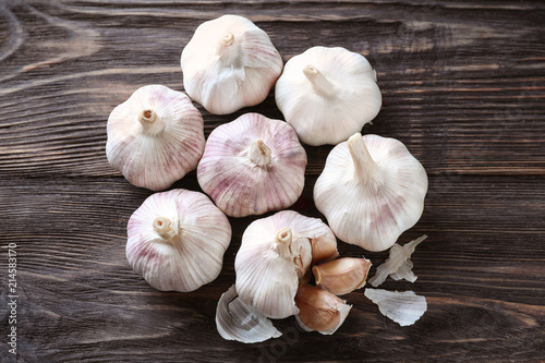 Fresh garlic on wooden background photo