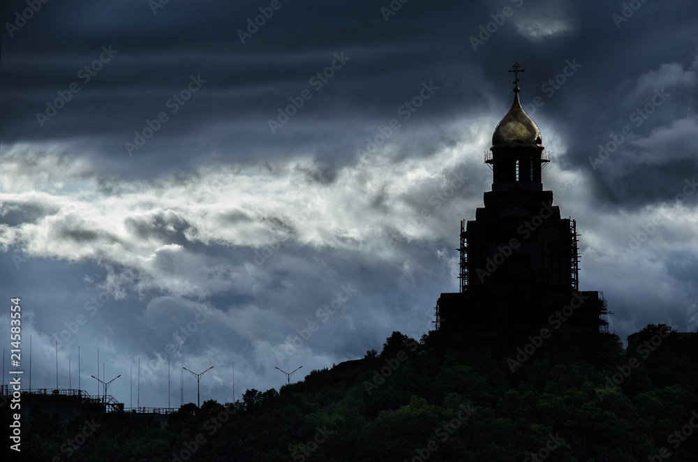 storm gray clouds and old gloomy Russian church