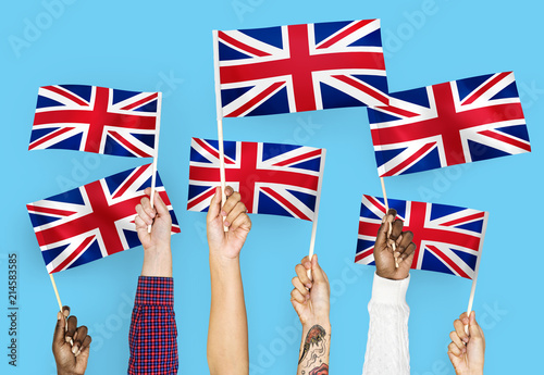Hands waving the Union Jack