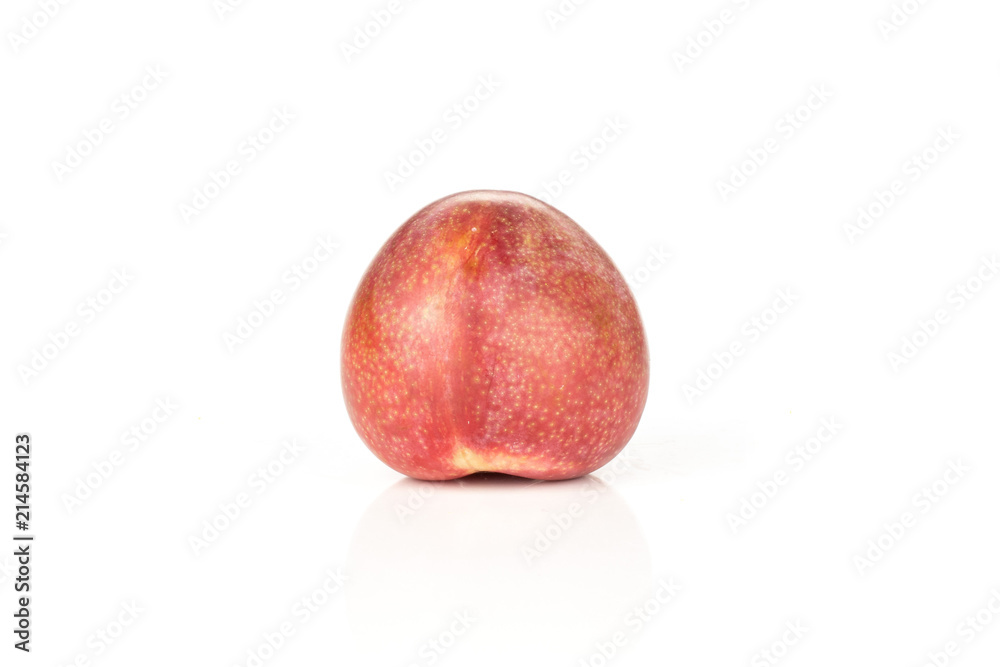One whole fresh pluot interspecific plums variety isolated on white One whole fresh pluot interspecific plums variety isolated on white