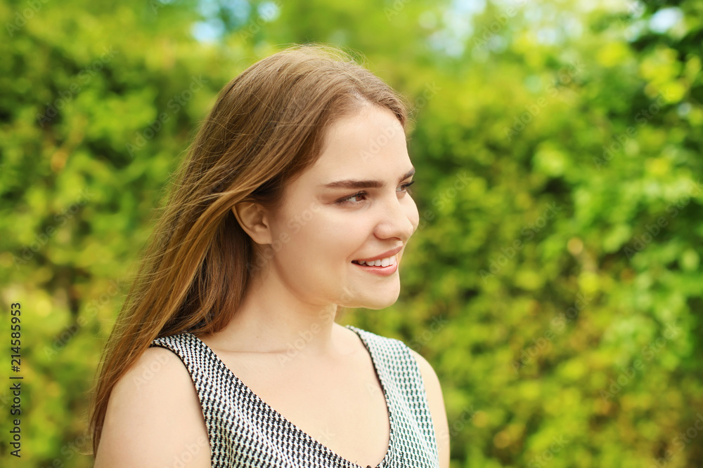 Portrait of beautiful young woman outdoors