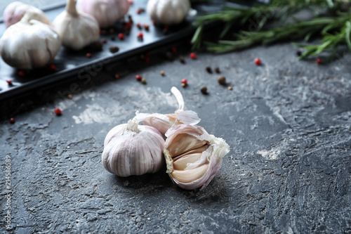 Fresh garlic on grey textured background