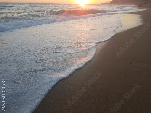 sunset sea waves foam splash in summer Preveza Vrahos Greece