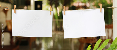 Fotografie Two blank instant photos hanging on a clothesline.