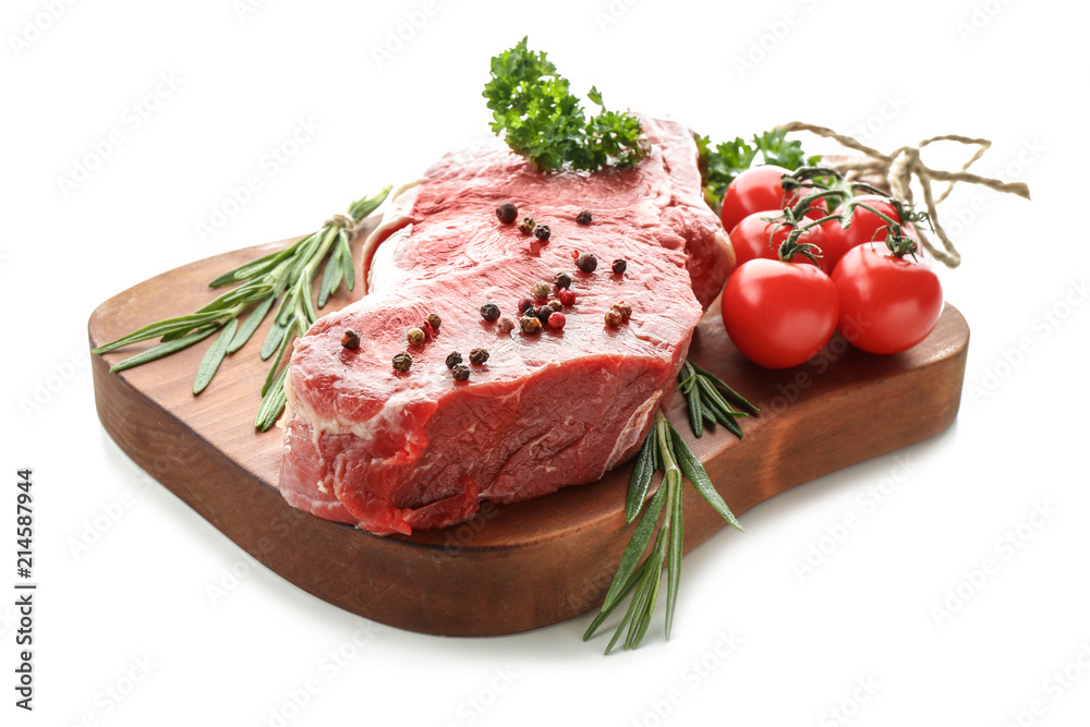 Wooden board with raw meat, vegetables and spices on white background Wooden board with raw meat, vegetables and spices on white background