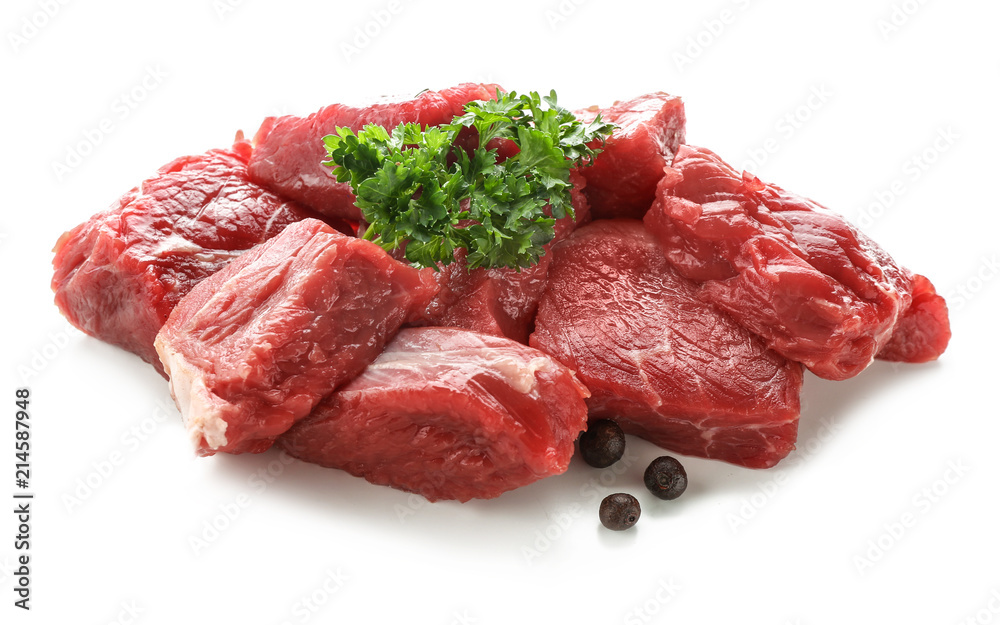 Pieces of raw meat with spices on white background