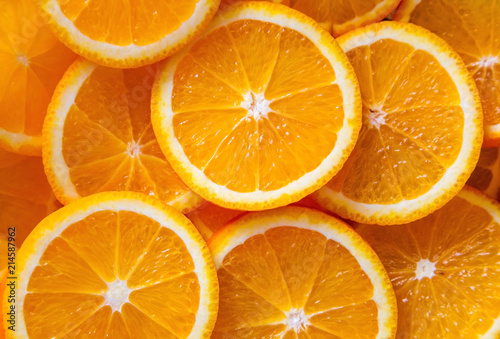 background made of sliced juicy oranges