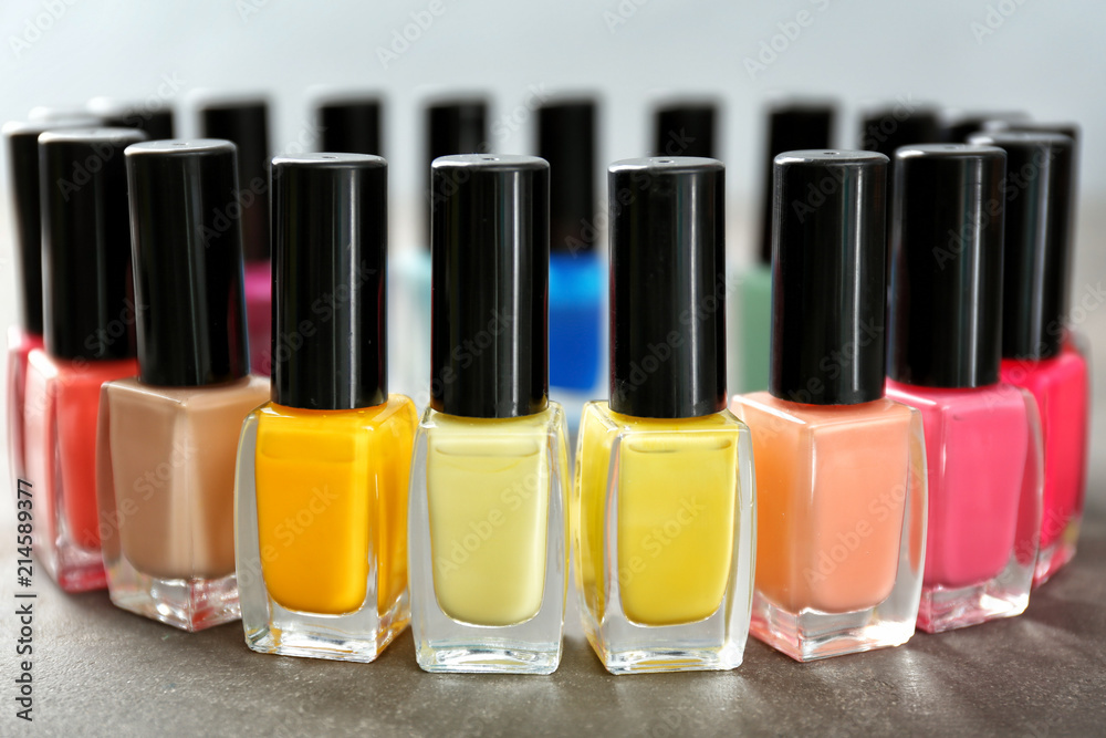 Bottles of colorful nail polishes on table Bottles of colorful nail polishes on table