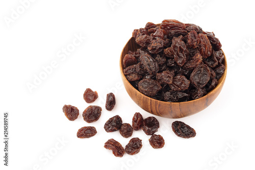 Organic dried Raisins in wooden bowls on white background, Currant