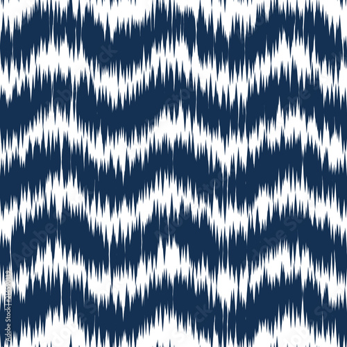Ikat ornament. Tribal Waves pattern in Aztec style. Hand Drawn folklore seamless pattern