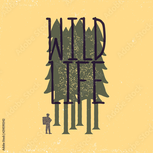 Vintage emblem of tourist-traveler in forest on yellow background and the inscription wild life . Grunge badge, typogrphic symbol suitable for T-shirts or print. Isolated vector illustration photo