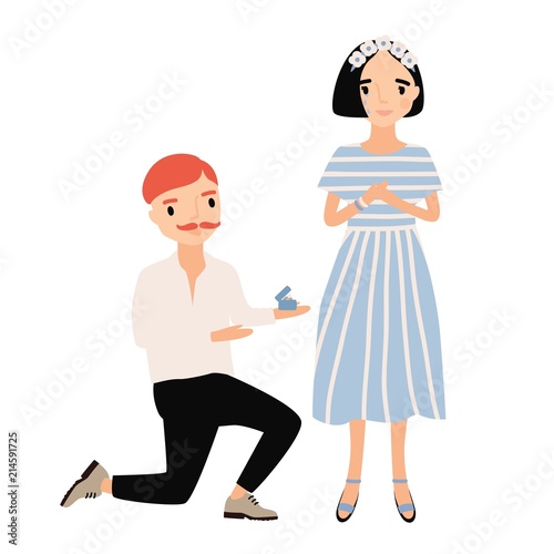 Man standing on one knee in front of woman and making her marriage proposal. ...