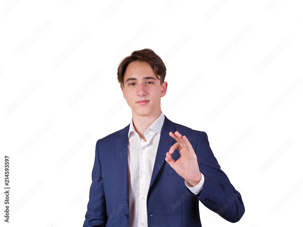 Studio portrait of teenage college student in suit. Portrait of elegant young man in suit, isolated on white background Studio portrait of teenage college student in suit. Portrait of elegant young man in suit, isolated on white background