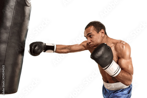 Sporty man during boxing exercise making hit. Photo of boxer on white background © master1305