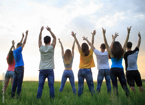 Group of young people on the field © Evgenia Tiplyashina