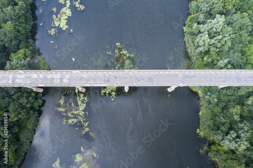 bridge through black river in Ukraine