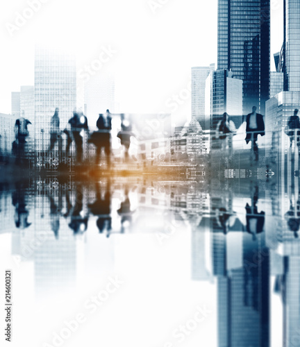 Silhouettes of people walking in the street near skyscrapers and modern office buildings in Paris business district. Multiple exposure blurred image. Economy, finances, business concept illustration