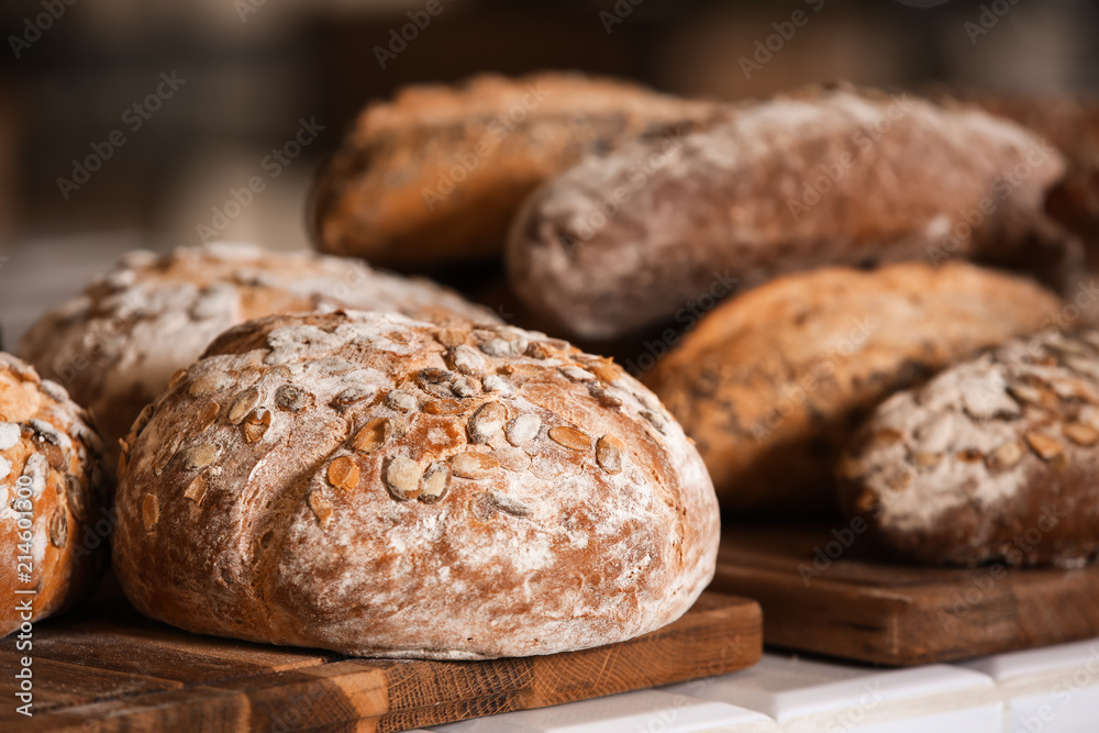 Assortment of fresh bread on counter in bakery