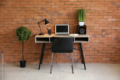 Stylish workplace with lapt...