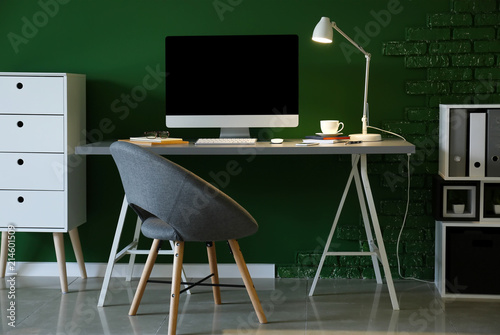 Stylish workplace with comp...
