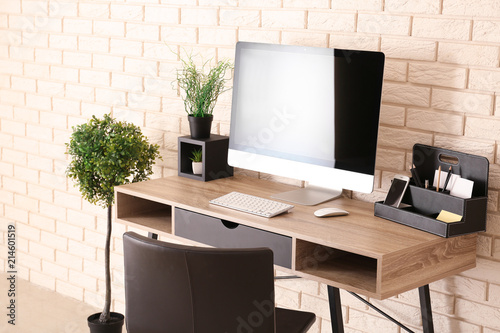 Stylish workplace with comp...