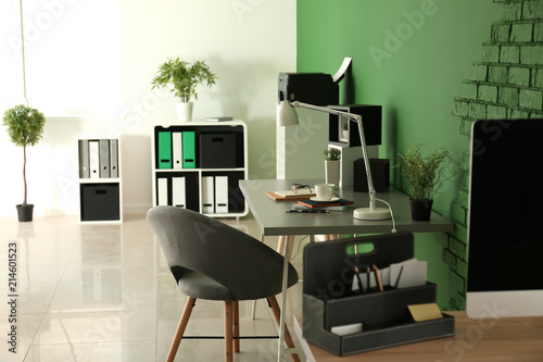 Stylish workplace with note...