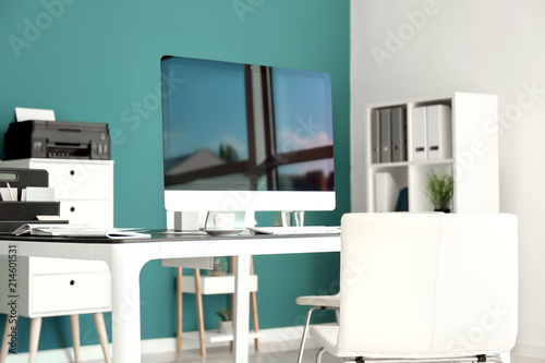 Stylish workplace with comp...