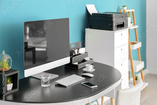 Stylish workplace with comp...
